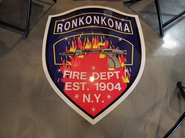a ronkonkoma fire department emblem is on the floor