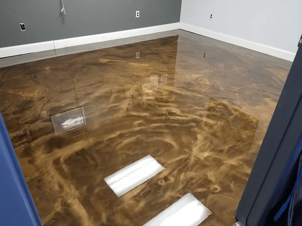 a room with a brown and gold metallic floor .