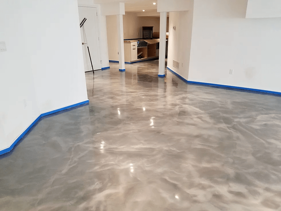 a room with a metallic floor and white walls