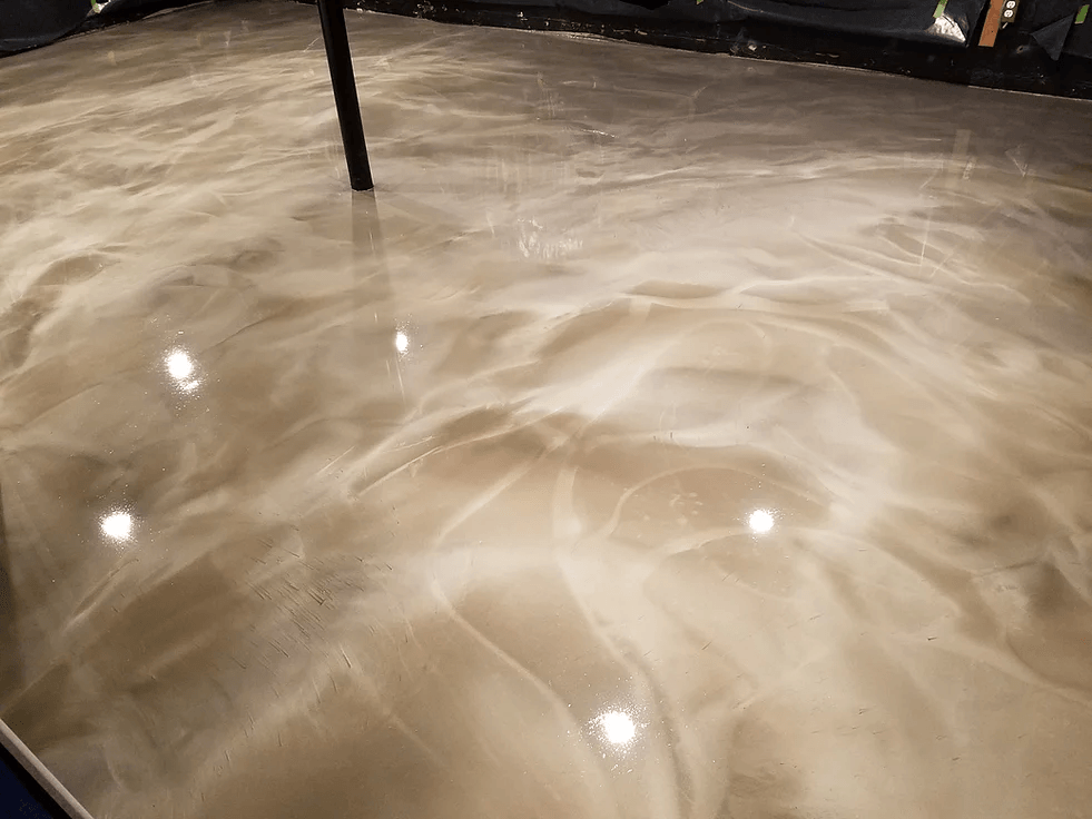 a close up of a shiny metallic floor in a basement .