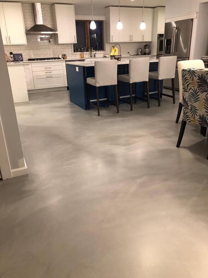 a kitchen with a large island in the middle of the room .