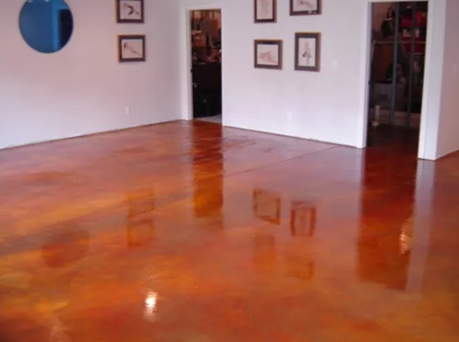 a room with a wooden floor and white walls