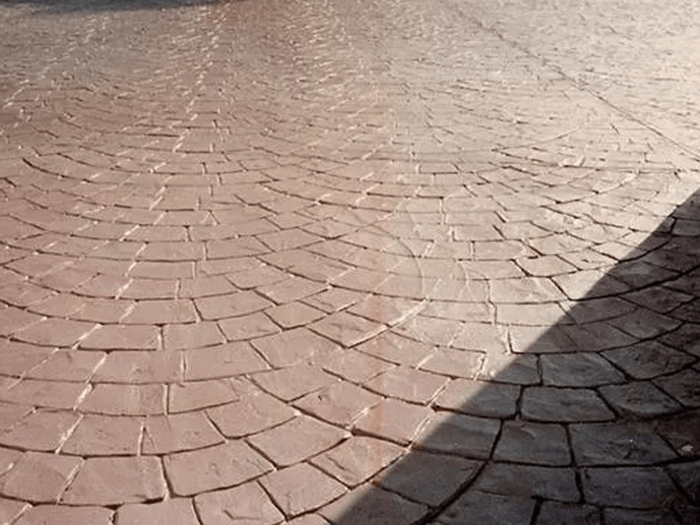 a close up of a brick floor with a shadow on it
