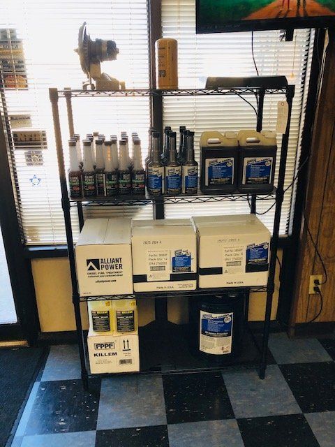 Shelf Filled with Fuel in Boxes and Bottles