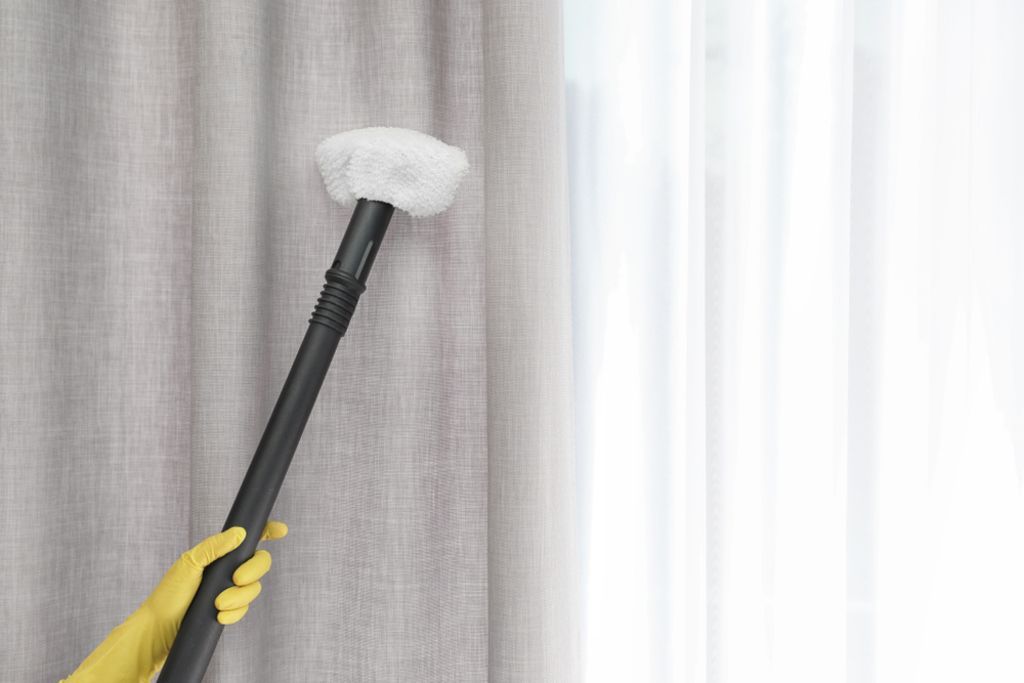 Cleaner Removing Dust From Curtain