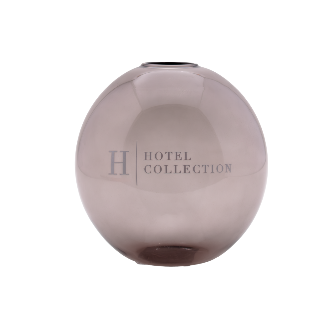 A round glass vase from the hotel collection