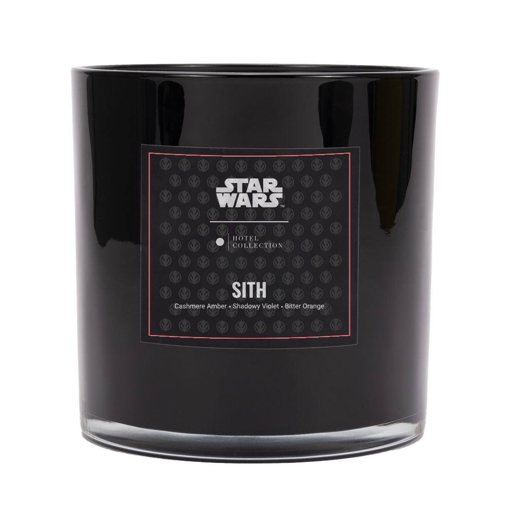 A black star wars candle with a label on it.