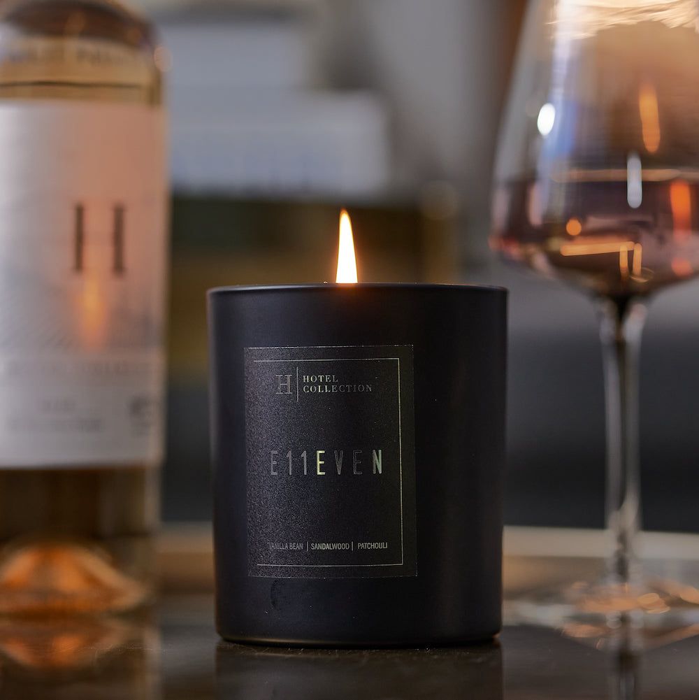 A black candle with the word eleven on it