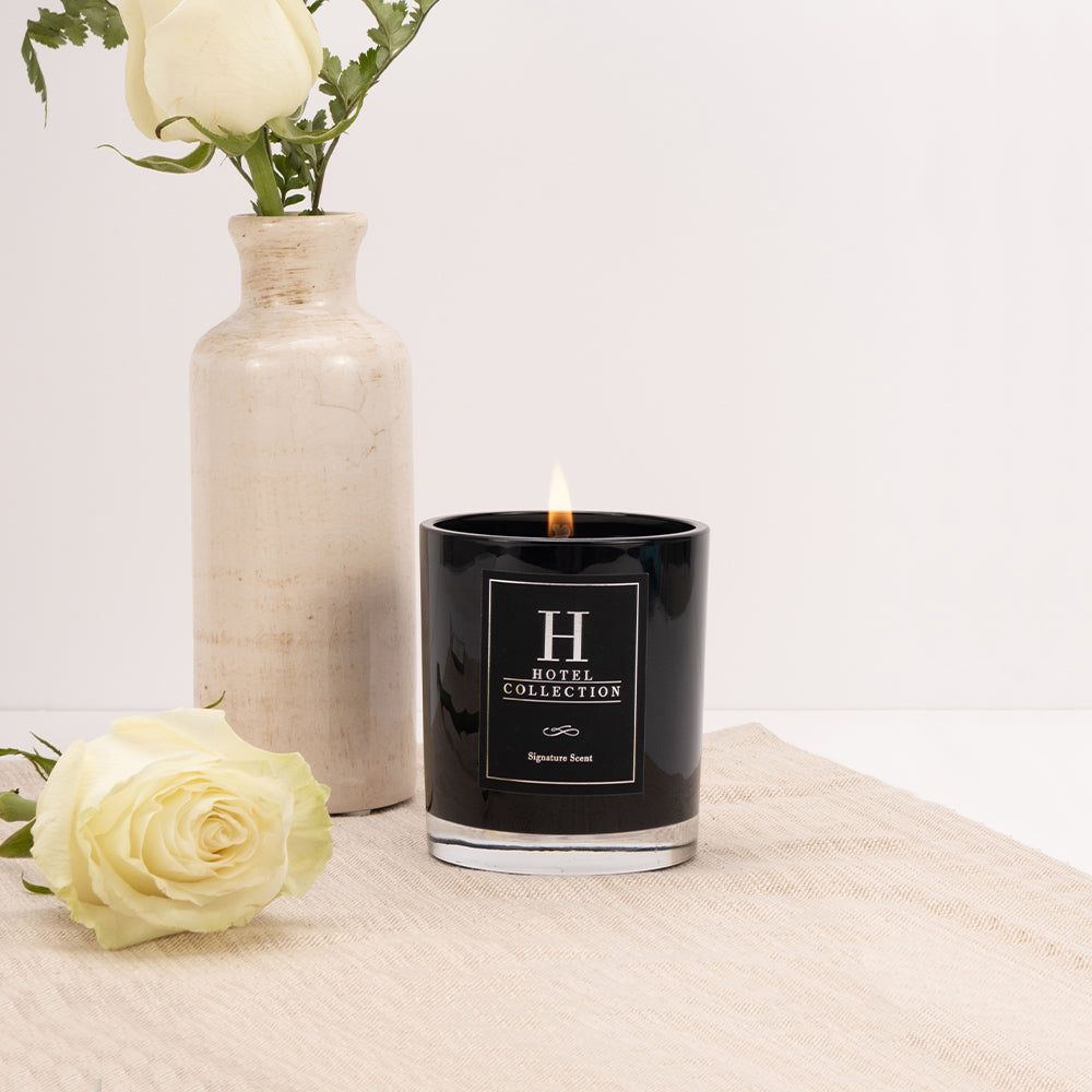 A black candle with the letter h on it