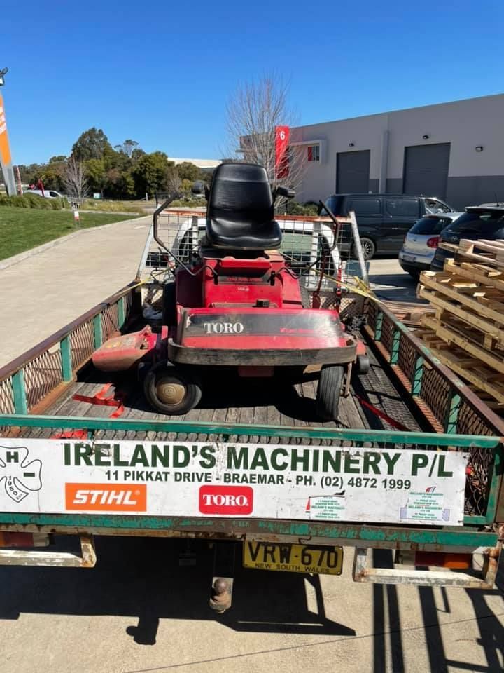 A Lawn Mower is Sitting on the Back of a Truck — Ireland's Machinery Pty Ltd in Braemar, NSW