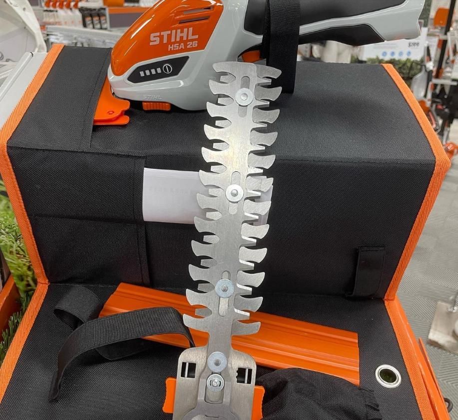 A Stihl Hedge Trimmer is Sitting on Top of a Box — Ireland's Machinery Pty Ltd In Braemar, NSW