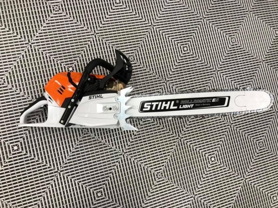 A STIHL Chainsaw is Sitting on a Carpet — Ireland's Machinery Pty Ltd In Braemar, NSW
