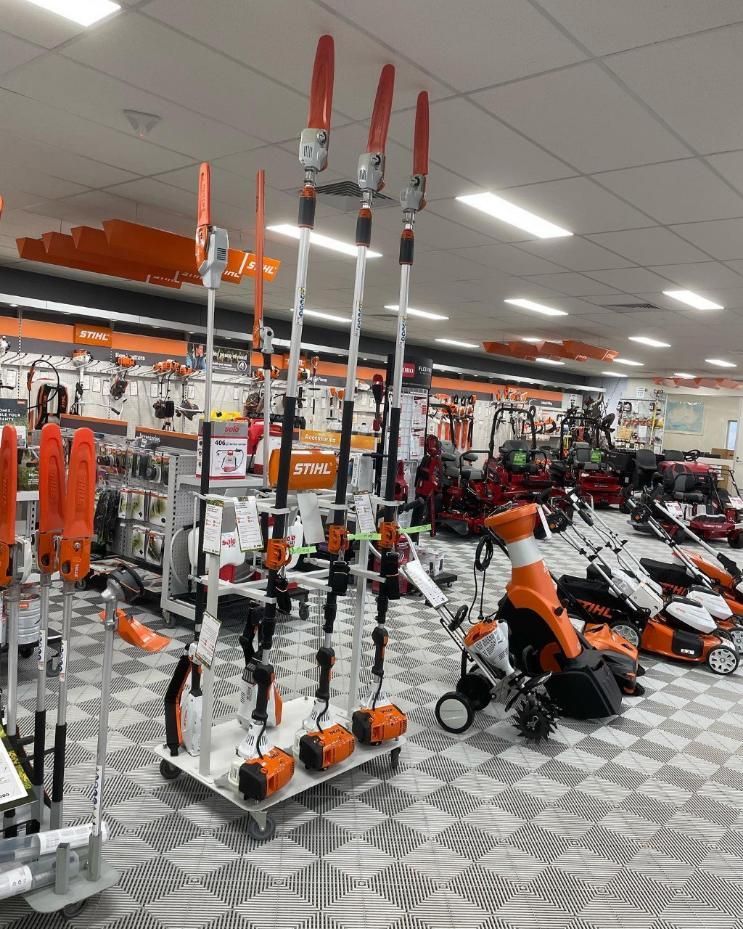 A Large Room Filled With Lots of Lawn Mower Equipment — Ireland's Machinery Pty Ltd In Braemar, NSW