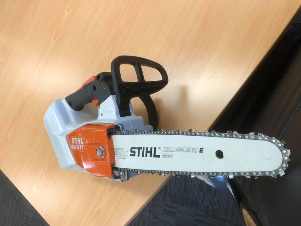 A Stihl Chainsaw Is Sitting On A Wooden Table — Ireland's Machinery Pty Ltd In Braemar, NSW