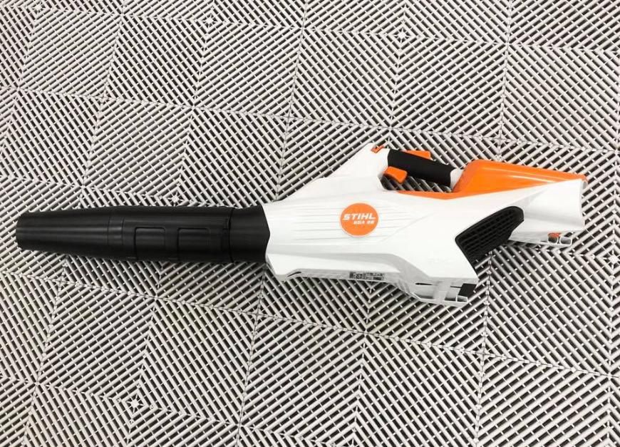A STIHL Blower is Sitting on a Checkered Carpet — Ireland's Machinery Pty Ltd In Braemar, NSW