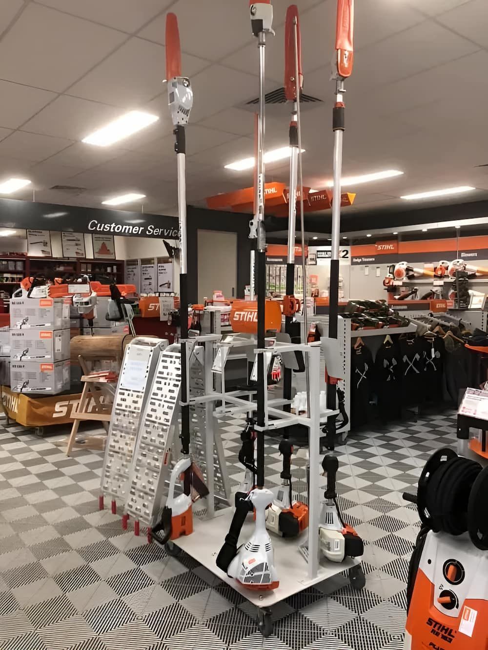 A Display of Stihl Tools in a Store With a Checkered Floor — Ireland's Machinery Pty Ltd In Braemar, NSW