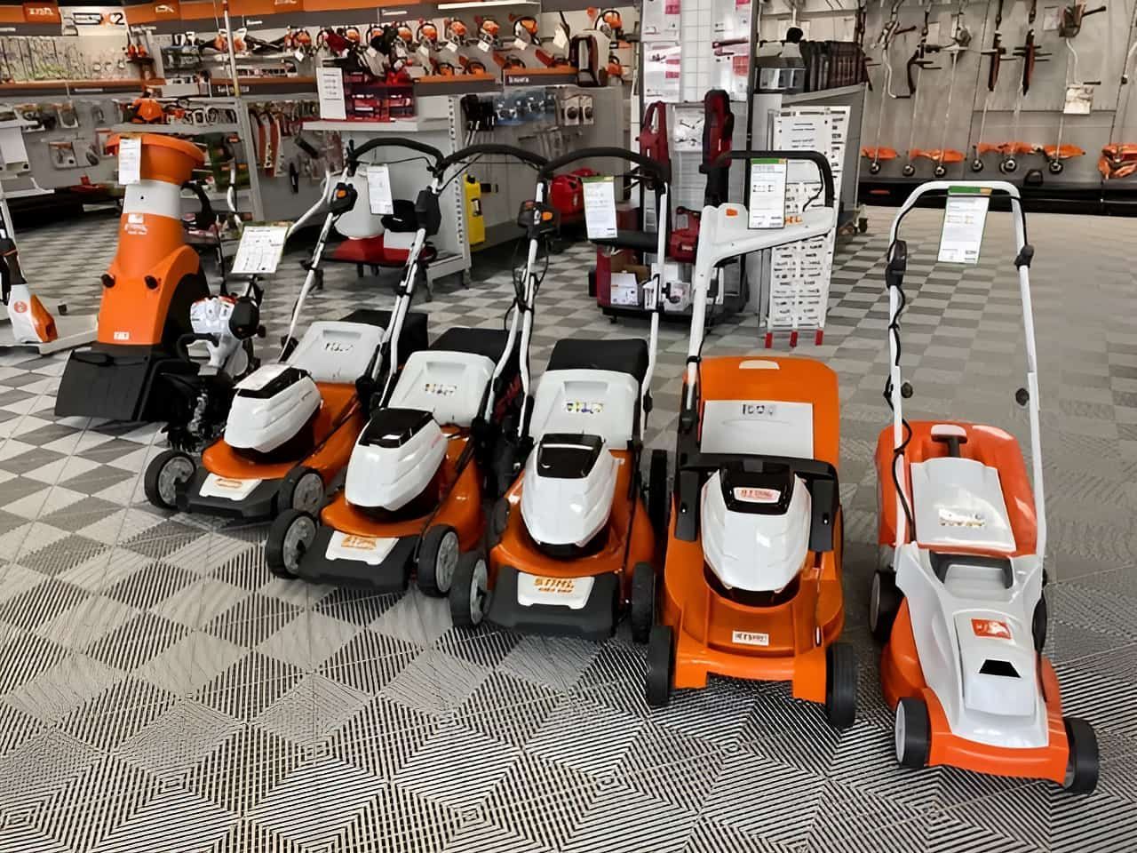 A Row of Lawn Mowers Are Lined Up in a Store — Ireland's Machinery Pty Ltd In Braemar, NSW