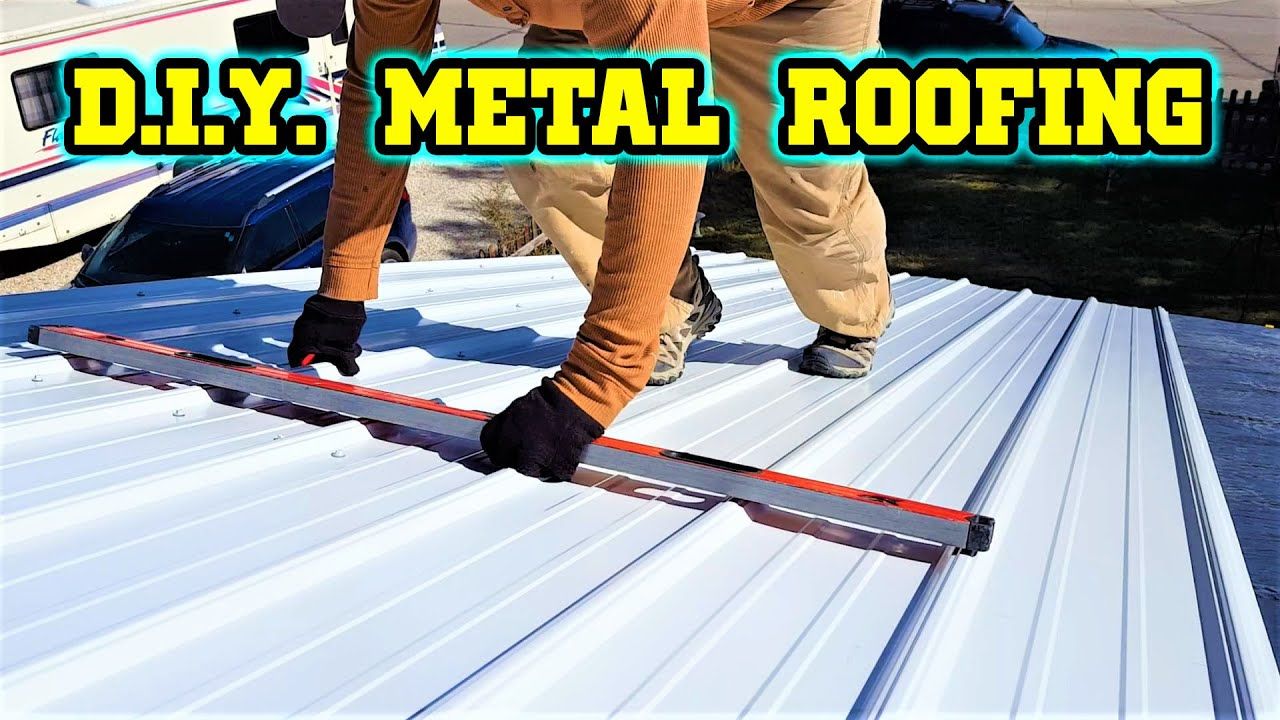 A man is measuring a metal roof with a ruler.