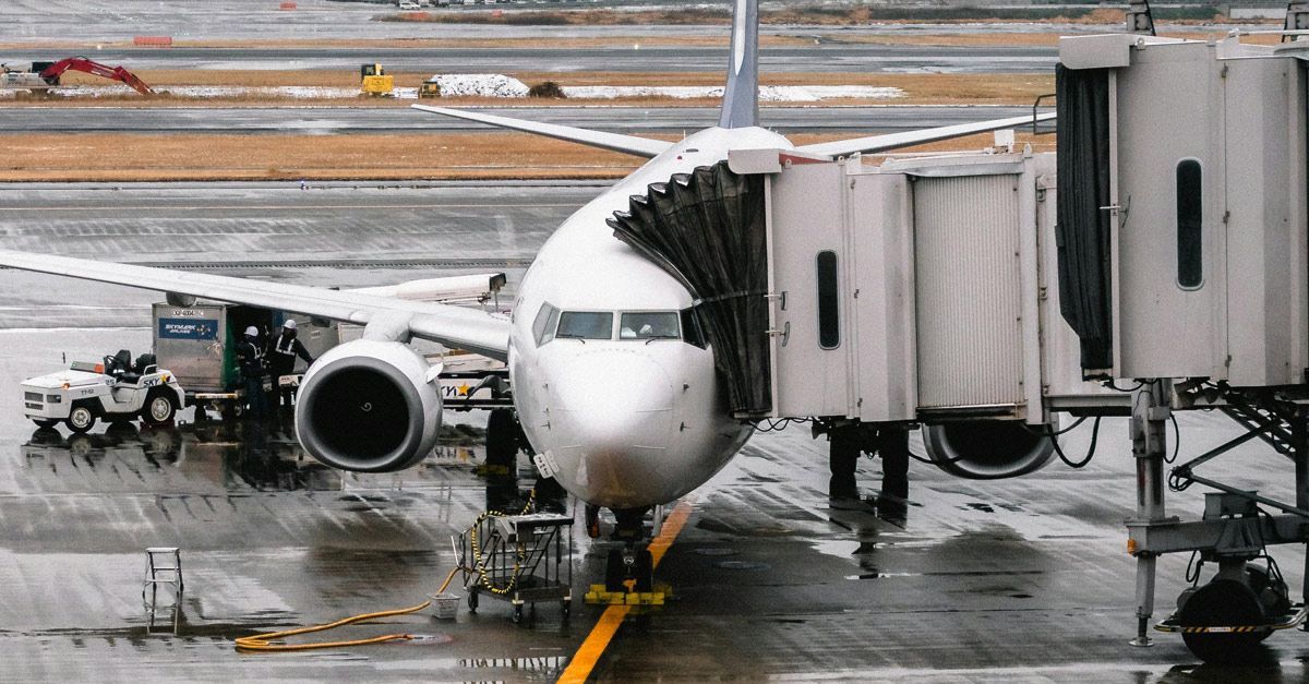 A large passenger jet is parked on the tarmac at an airport.