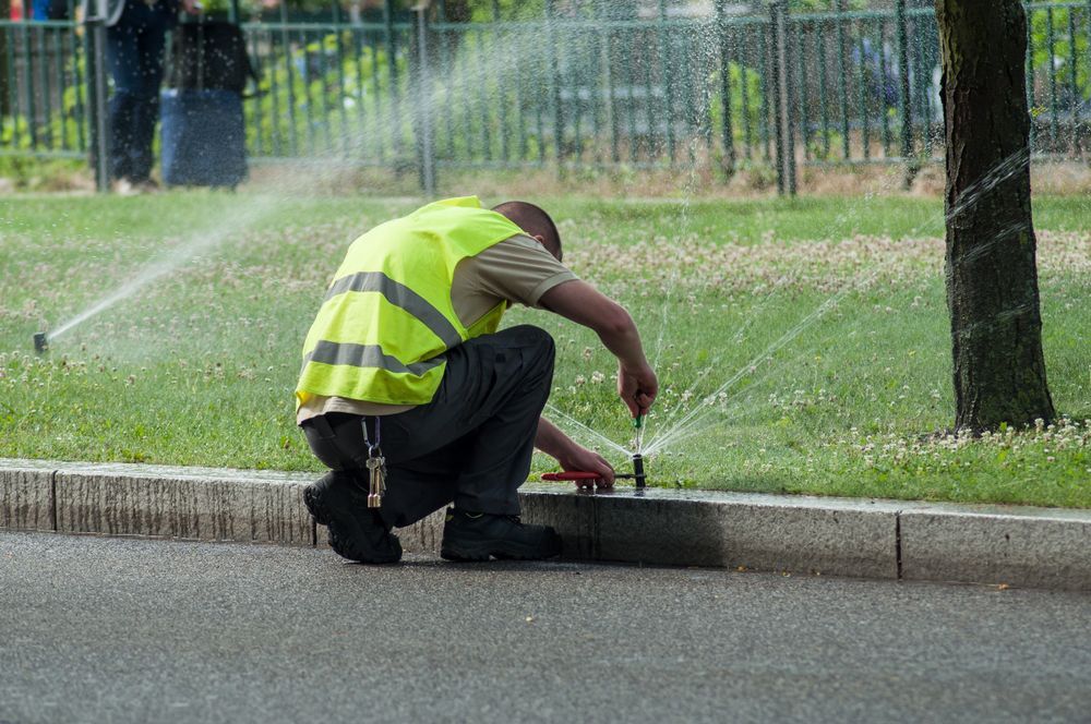 adjusting automatic sprinklers on tramway line