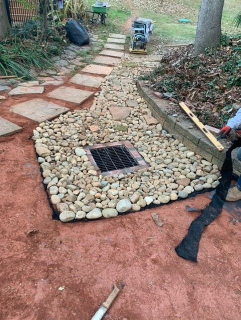 A man is working on the side of a house.