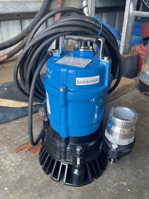 Blue Submersible Pump with Coiled Black Hose — Bowen Hire in Proserpine, QLD