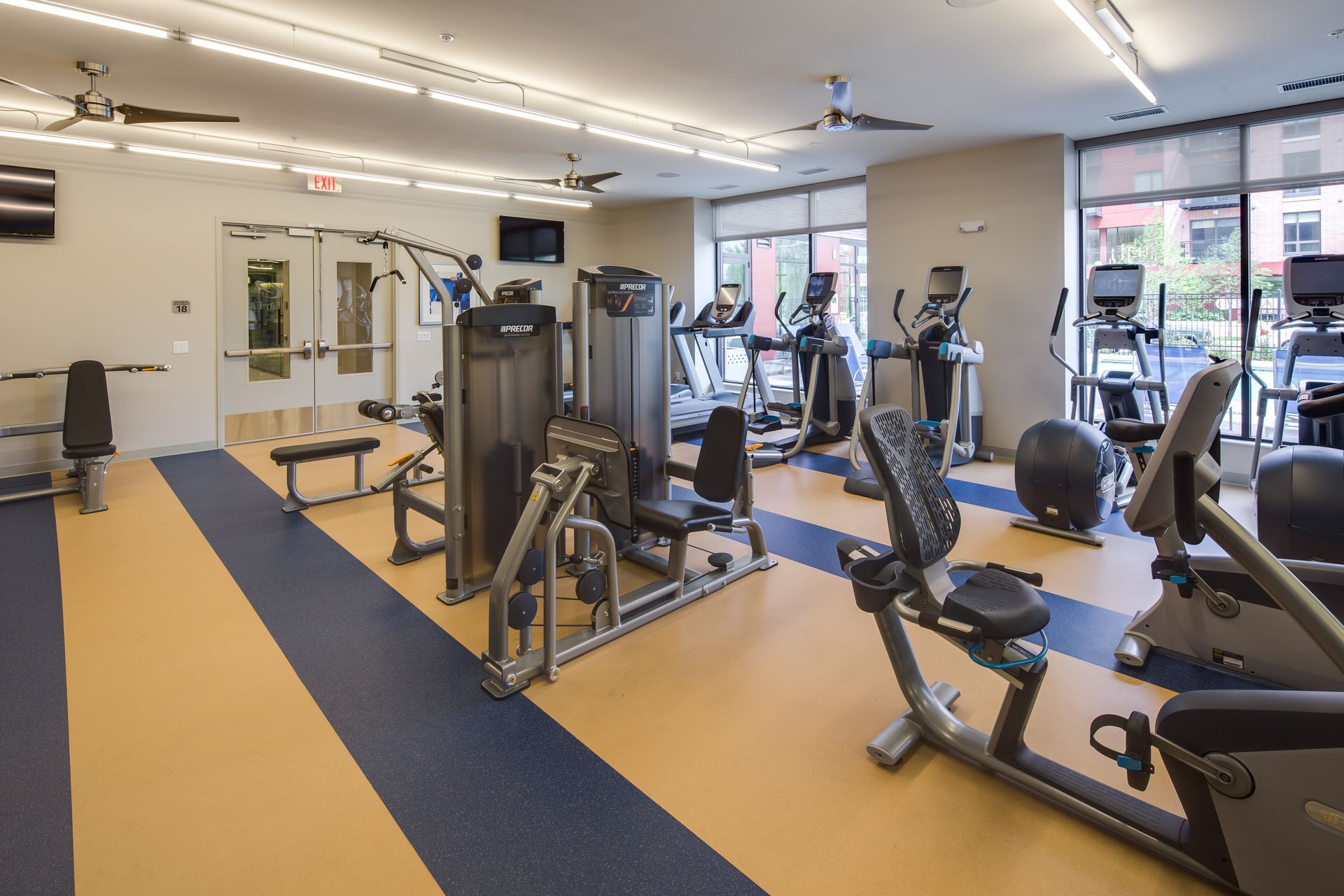 A large gym with a lot of exercise equipment