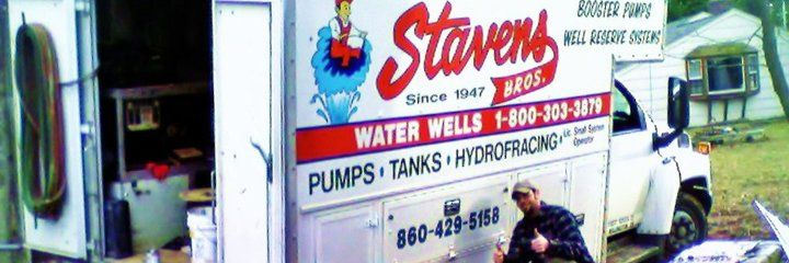 A Stevens Bros. water well truck with a man giving a thumbs up.