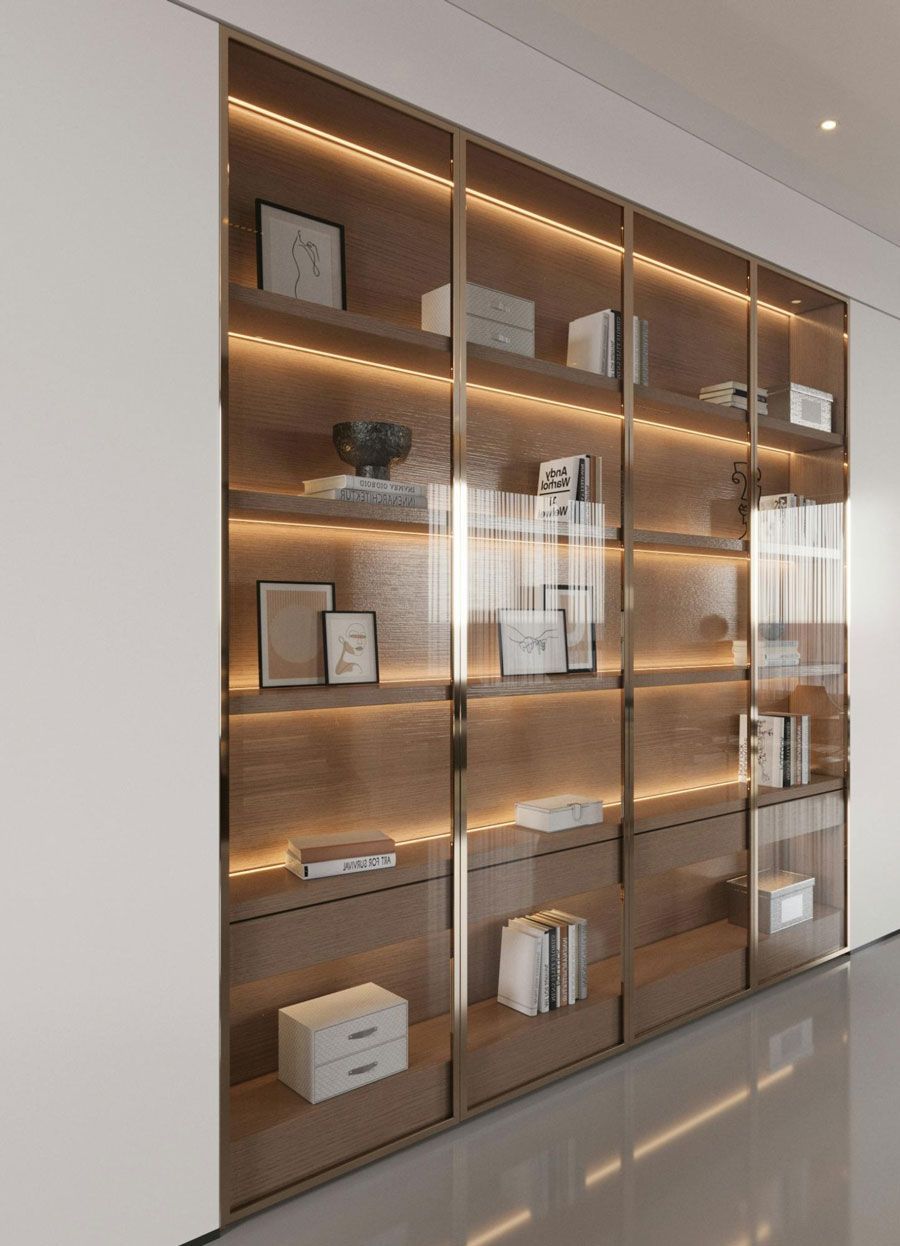 A bookshelf with a lot of books and pictures on it
