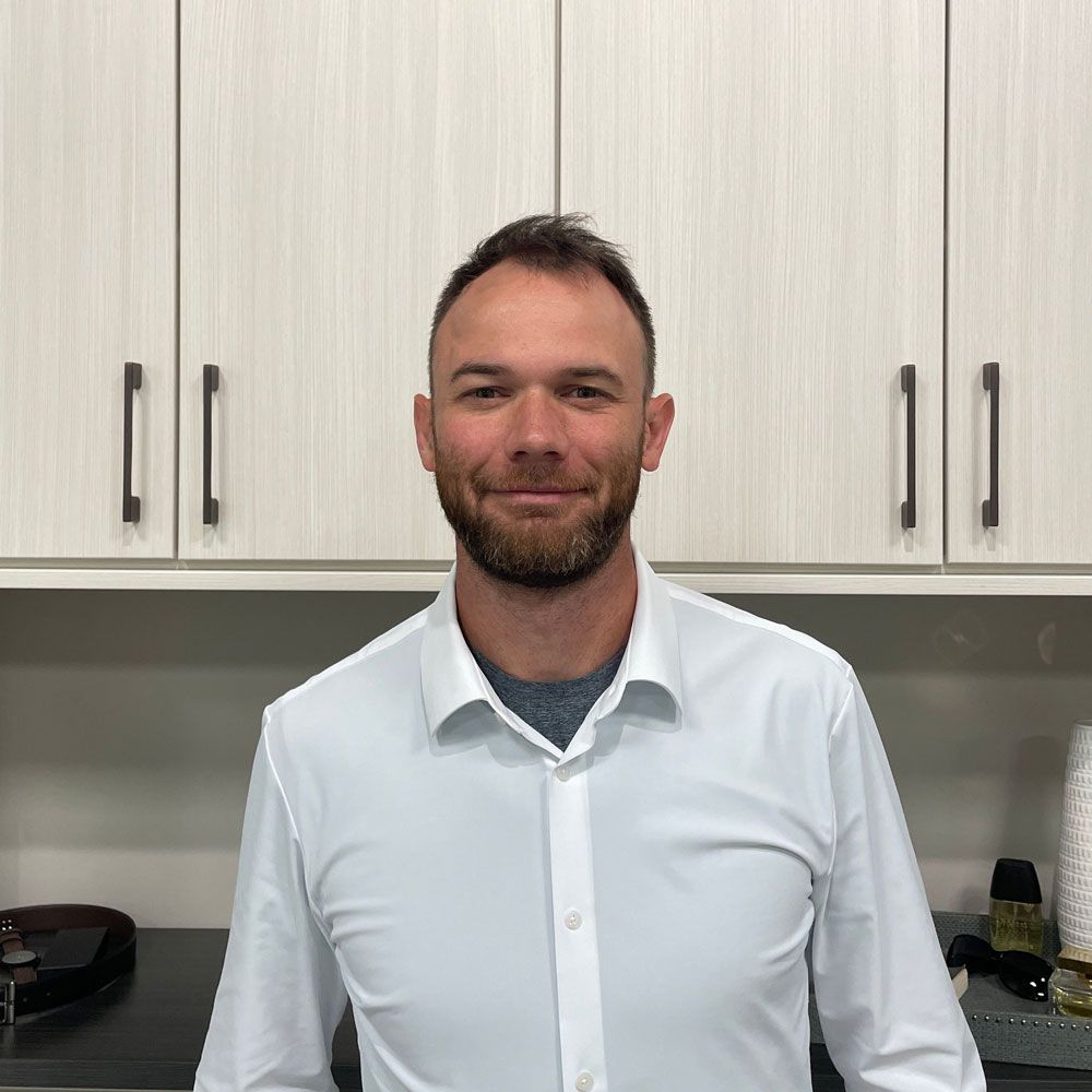 A silhouette of a person in a circle on a gray background.
