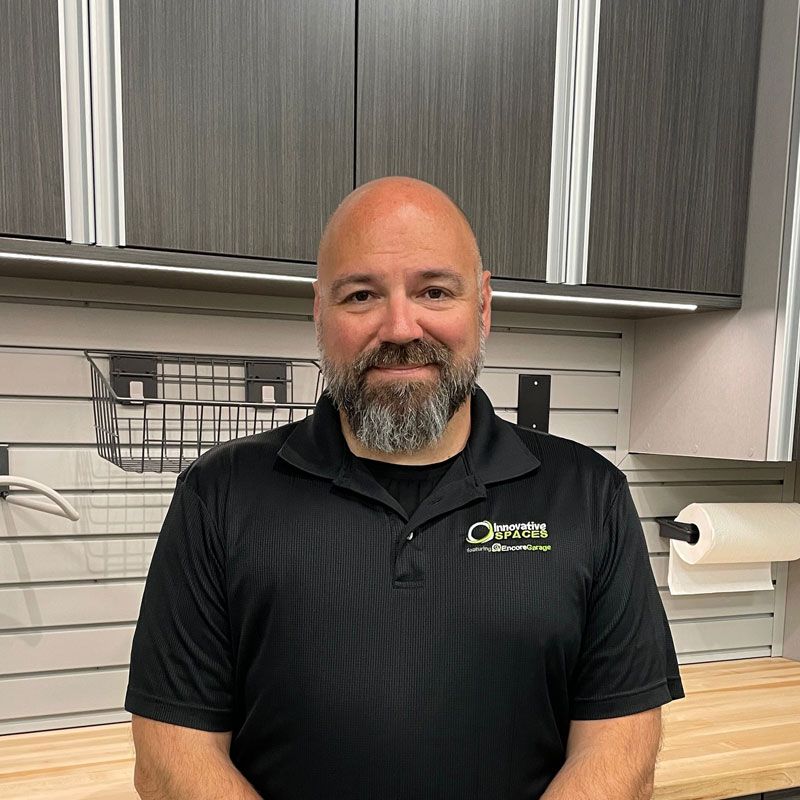 A silhouette of a person in a circle on a gray background.