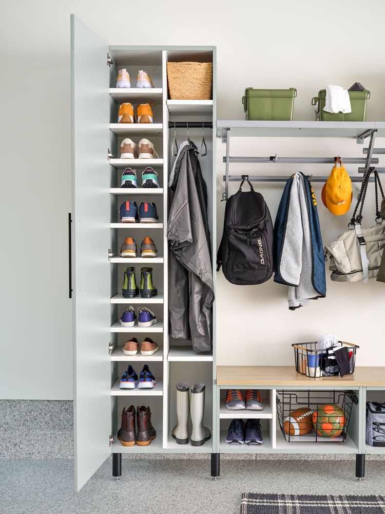 A closet with a lot of shoes and clothes in it