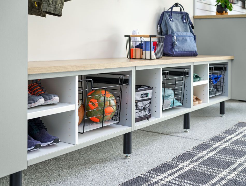 A shoe rack with a soccer ball and a backpack on it.