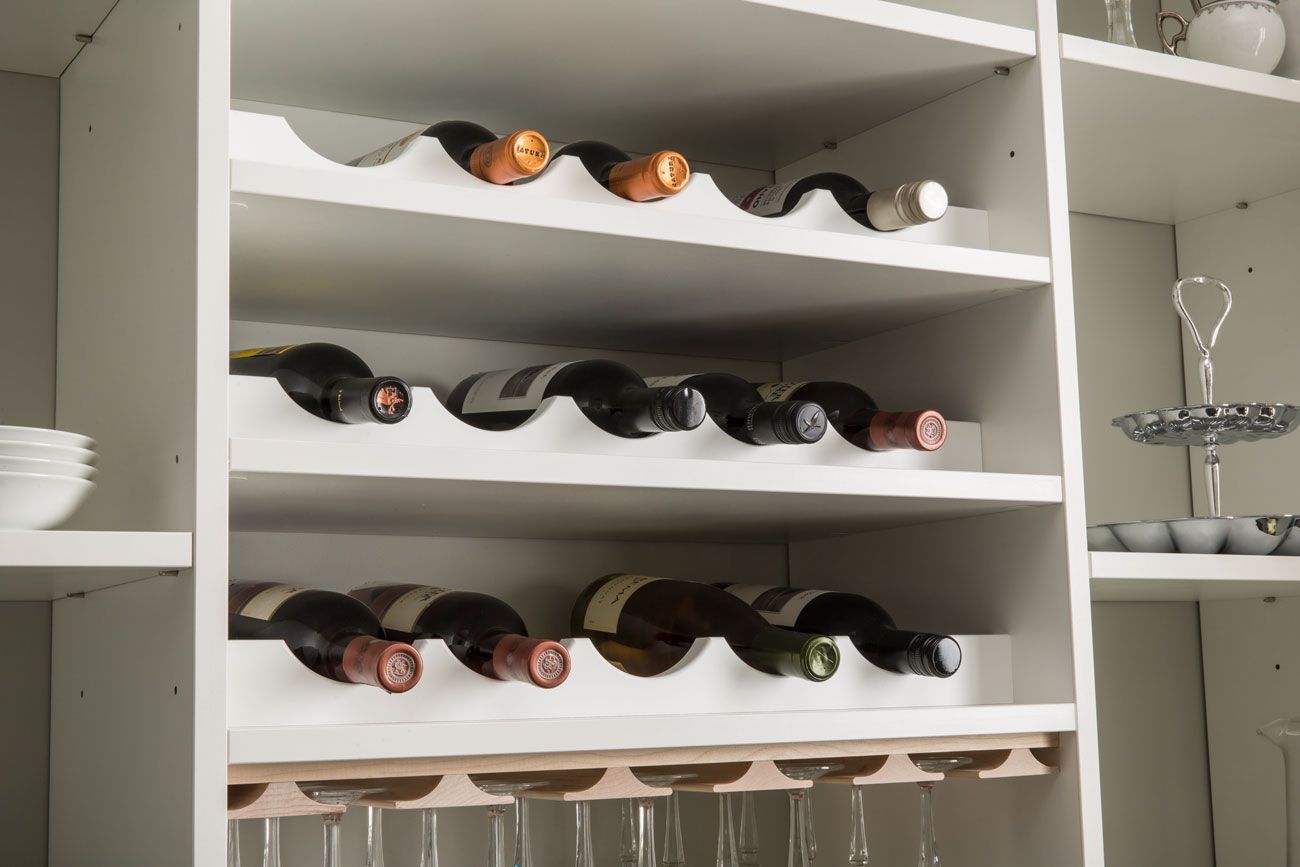 A wine rack with bottles and glasses on it
