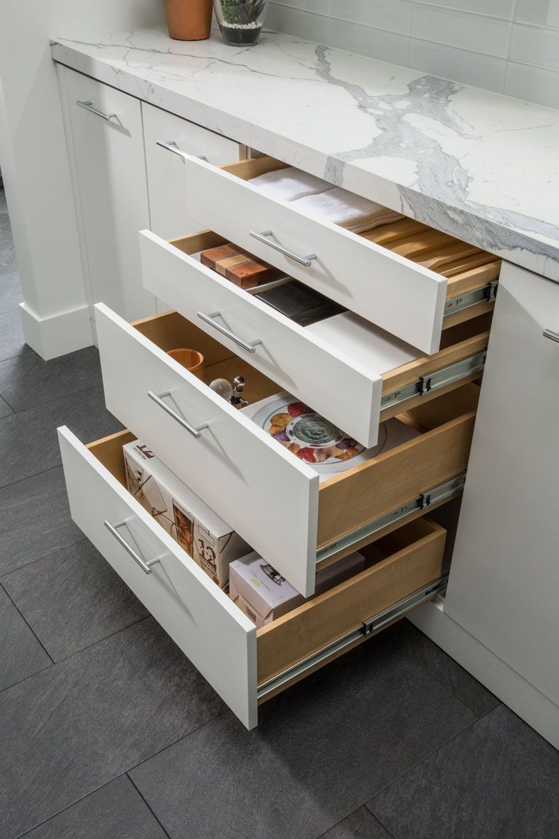 Open pantry drawers showcasing organized storage space.