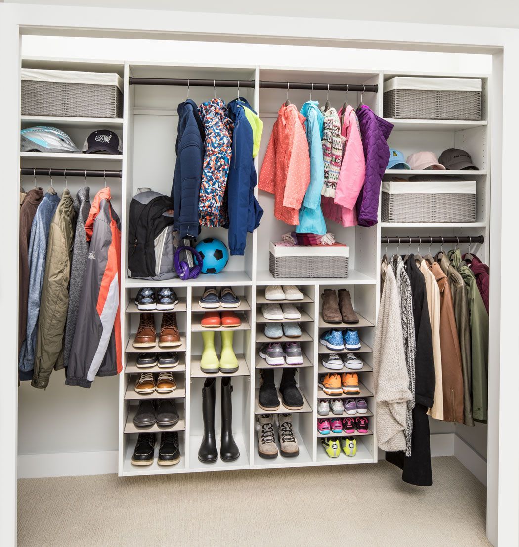 A closet filled with lots of clothes and shoes