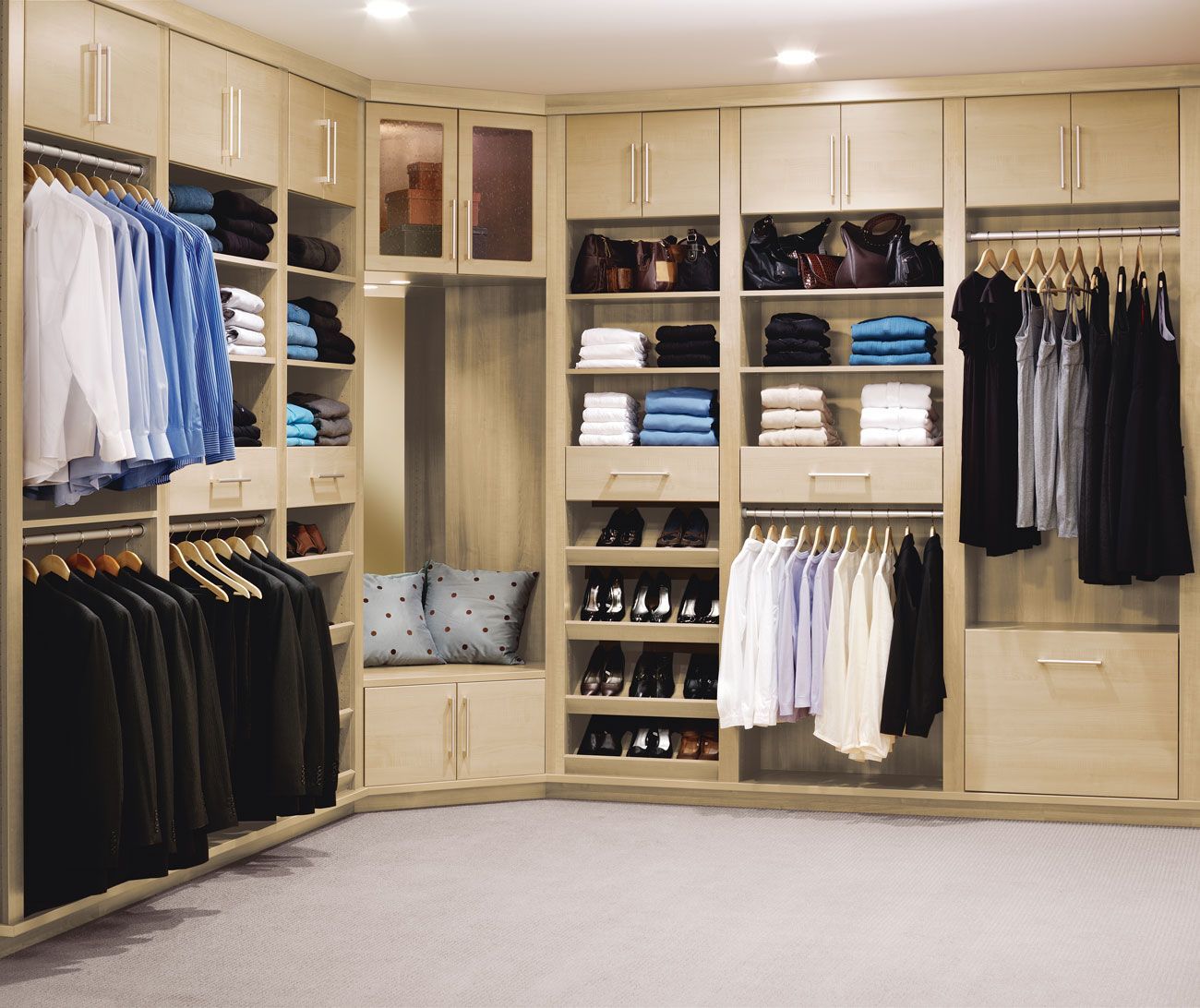 A walk-in closet filled with clothes and shoes.