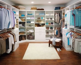 A walk in closet filled with clothes and shoes