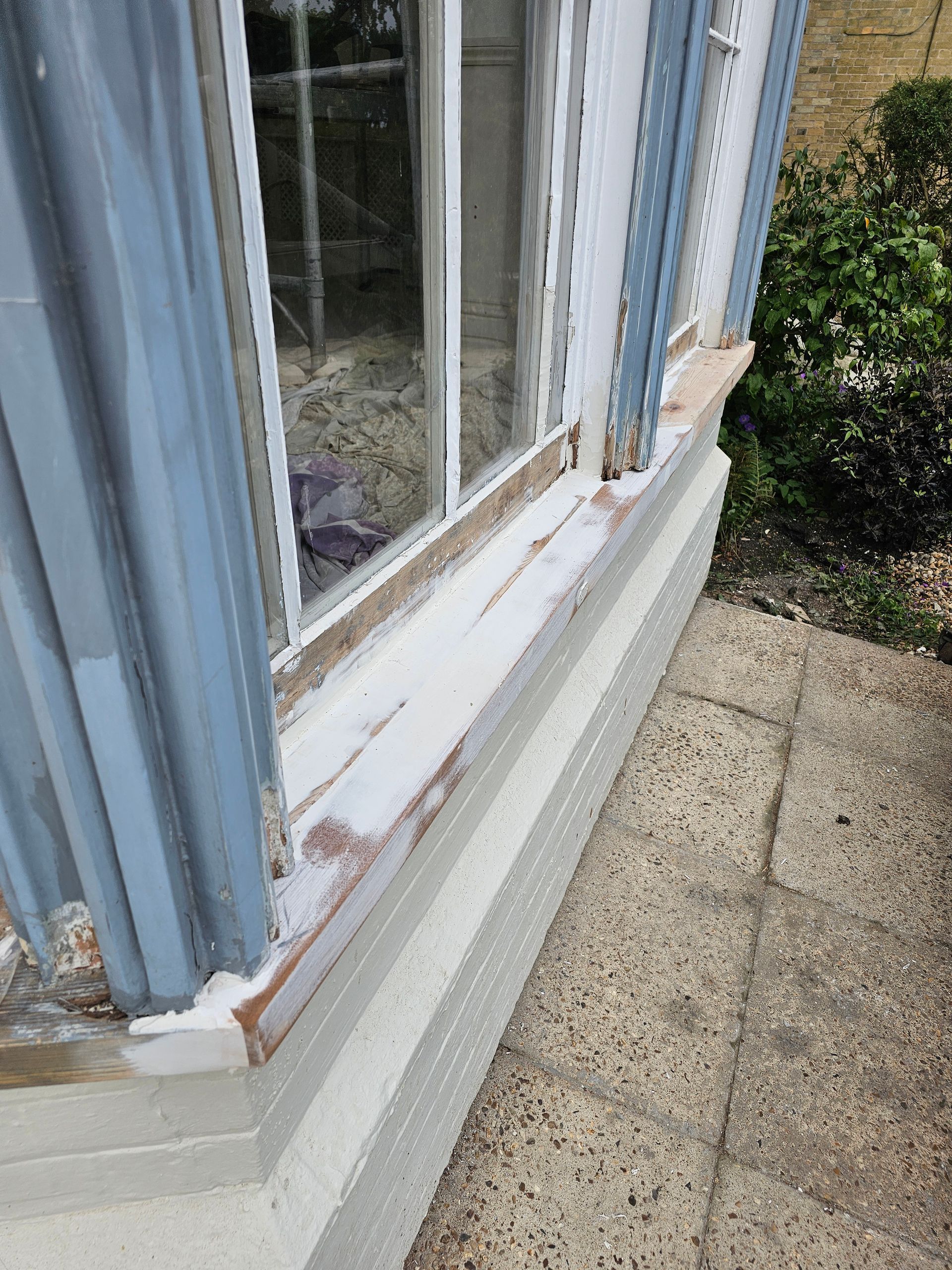 A close up of a window on the side of a building.