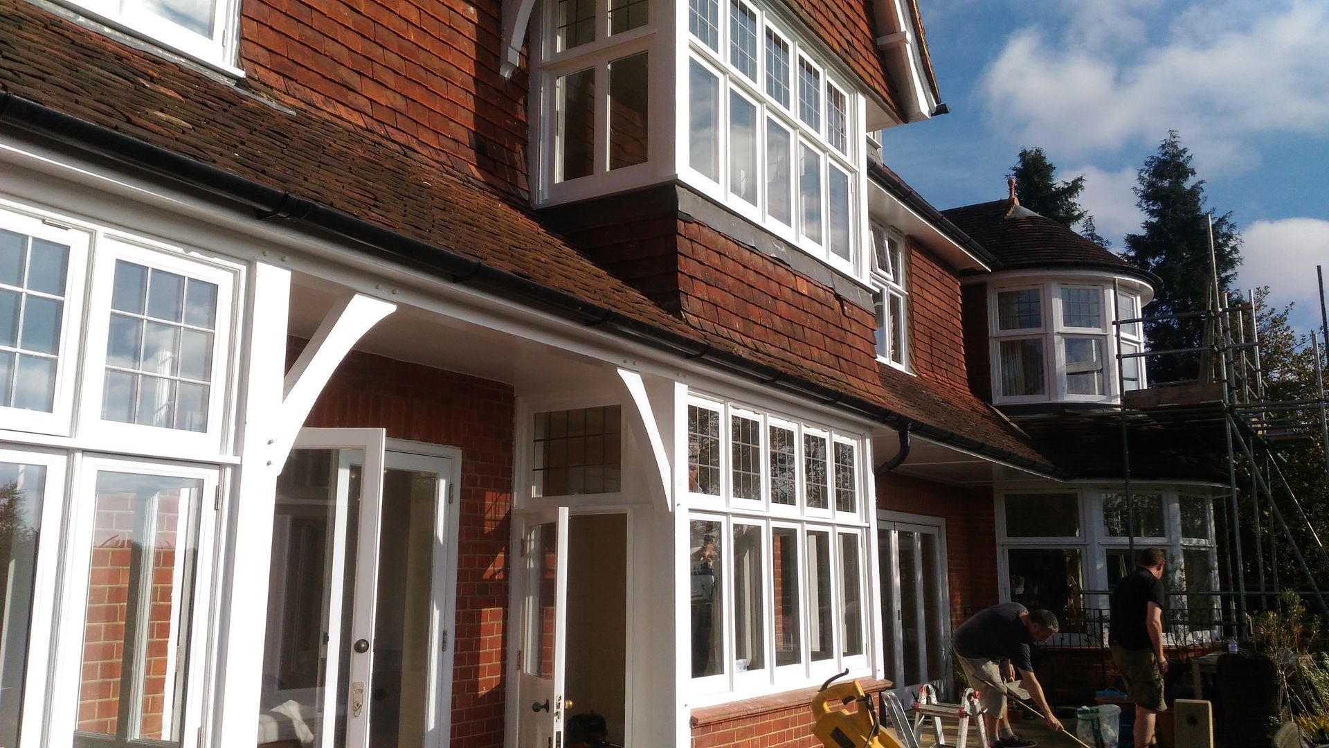 A large brick house with a lot of windows