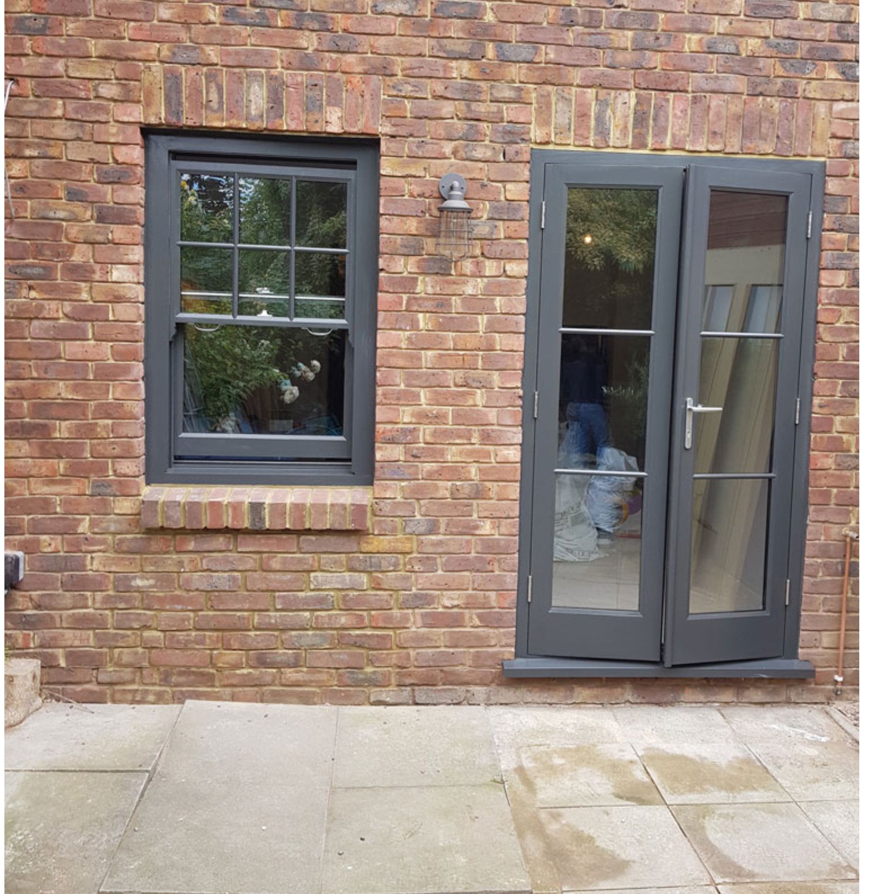 A brick building with a window and a door