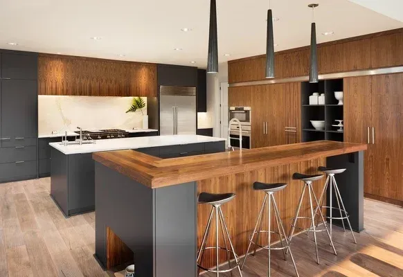 A kitchen with a large island and stools