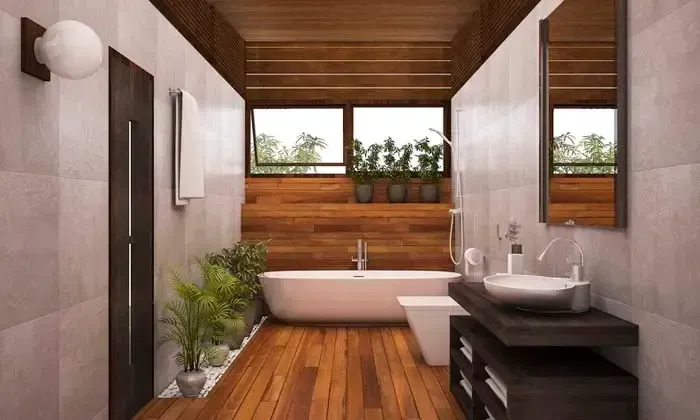 A bathroom with a bathtub , sink and mirror.