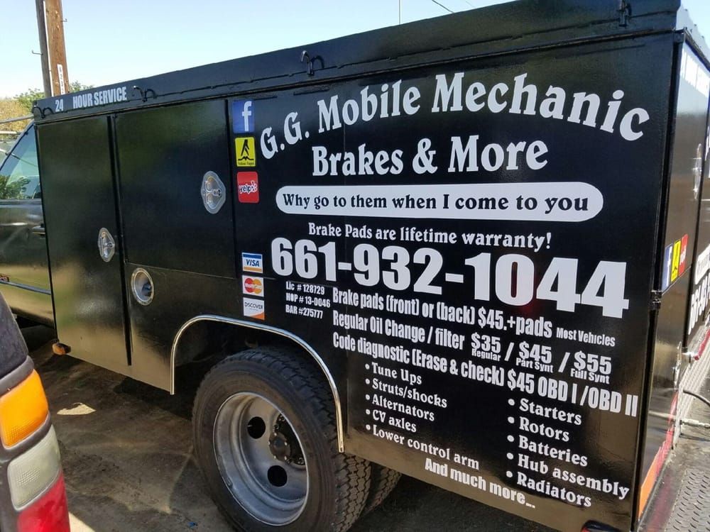 Black mobile mechanic truck with business name 