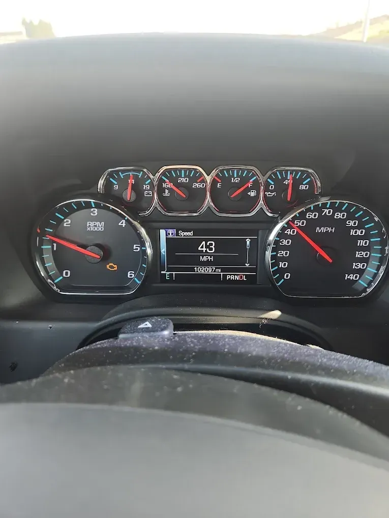 Dashboard with speedometer at 43 mph, tachometer at low RPM, and other gauges visible.