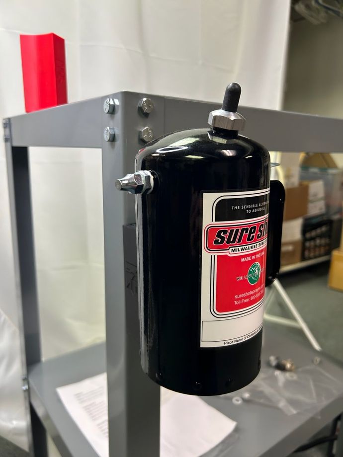 A Spray Can is Sitting on Top of a Shelf — Sure Shot Sprayer Australia in Alice Springs, NT