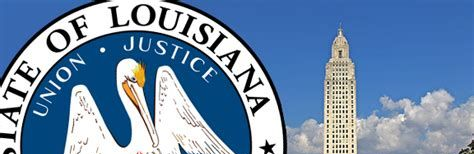 Seal of Louisiana with a pelican and state capitol building in the background against a blue sky.