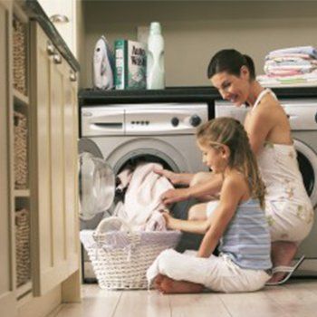 mother and daughter in laundry room - Baker Appliance And Refrigeration Service In Yorktown, VA