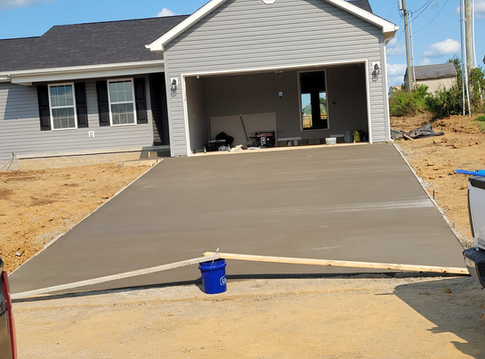 A Concrete Driveway Is Being Built In Front Of A House - Owingsville, KY - Withrow Builders