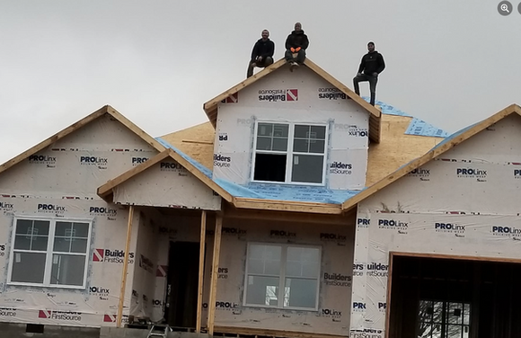 Three Men Are Standing On The Roof Of A House Under Construction - Owingsville, KY - Withrow Builders